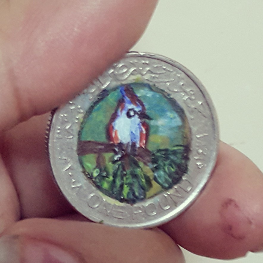 Tiny Bird On A Coin